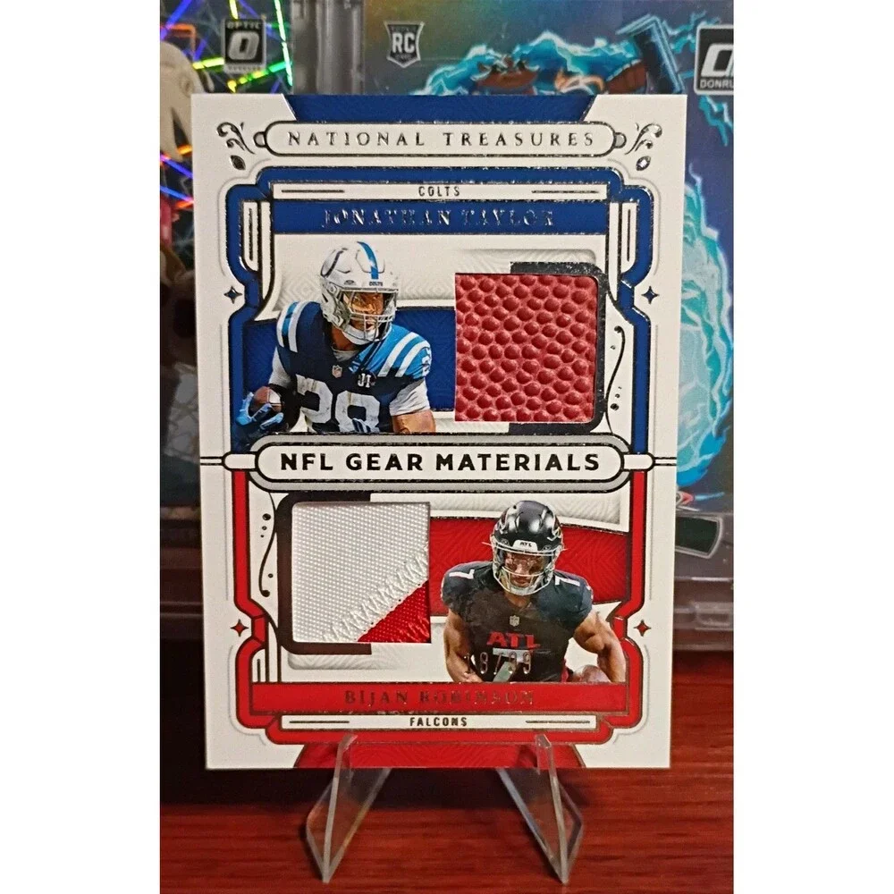 2025 Panini National Treasures - Nfl Gear Jonathan Taylor, Bijan Robinson 18/99